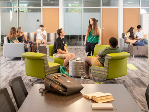 students interacting in the hollis family student success center