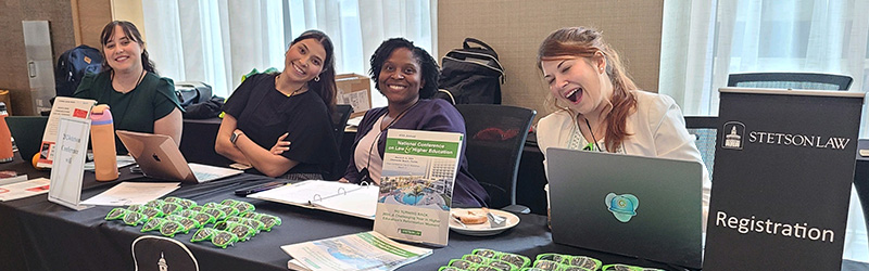 Registration table at the 2024 Law and Higher Education Conference